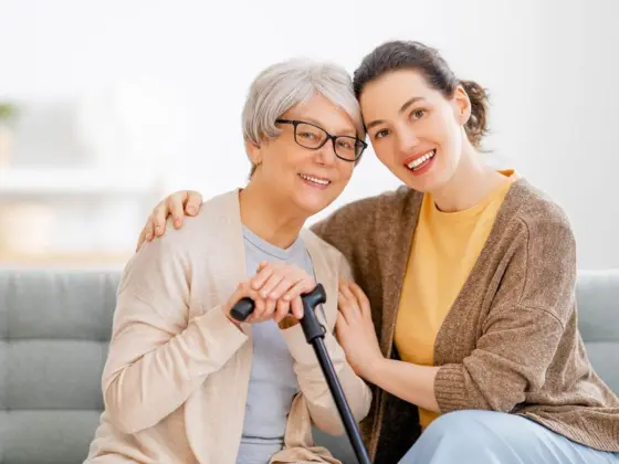 Home 7 Two senior residents enjoying companionship together in personalised assisted living care