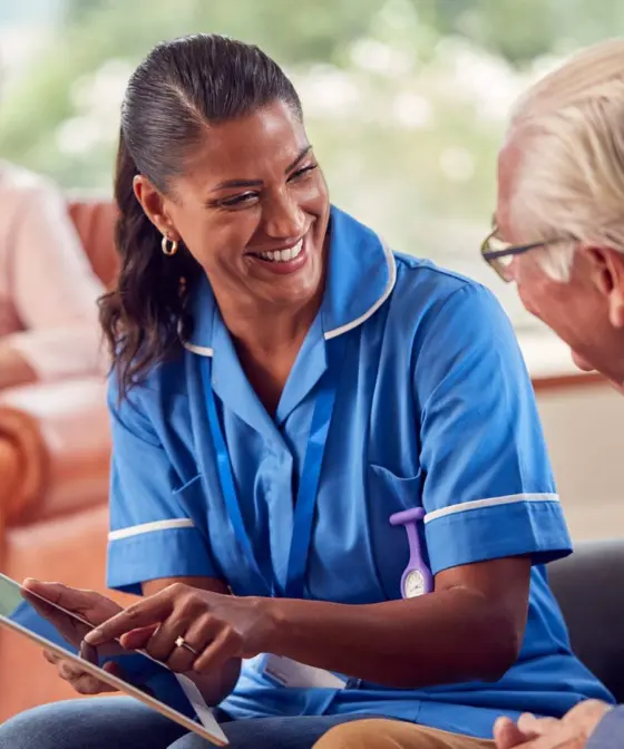 Home 15 Vetted caregiver giving one-to-one attention to a senior resident in assisted living
